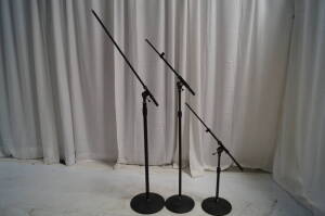 Lot Standard Black Mic Stand Kits Includes (12) Short Mic Stands w/ Boom, (12) Regular Mic Stands w/ Boom, (2) Tall Heavy Mic Stands w/ Long Boom, (24) Regular Round Bases, (2) Heavy Round Bases)