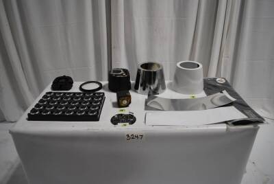 Lot of Various AX5 Parts: Backs w/ Buttons (10) Front Lense Cover (10), Lens (30), Bodies (5) Battery (4) Internal Component (9) Mirror Cover (1), White Cover (16), Bag of Mirror Covers (5) Bag Of White Covers (5)